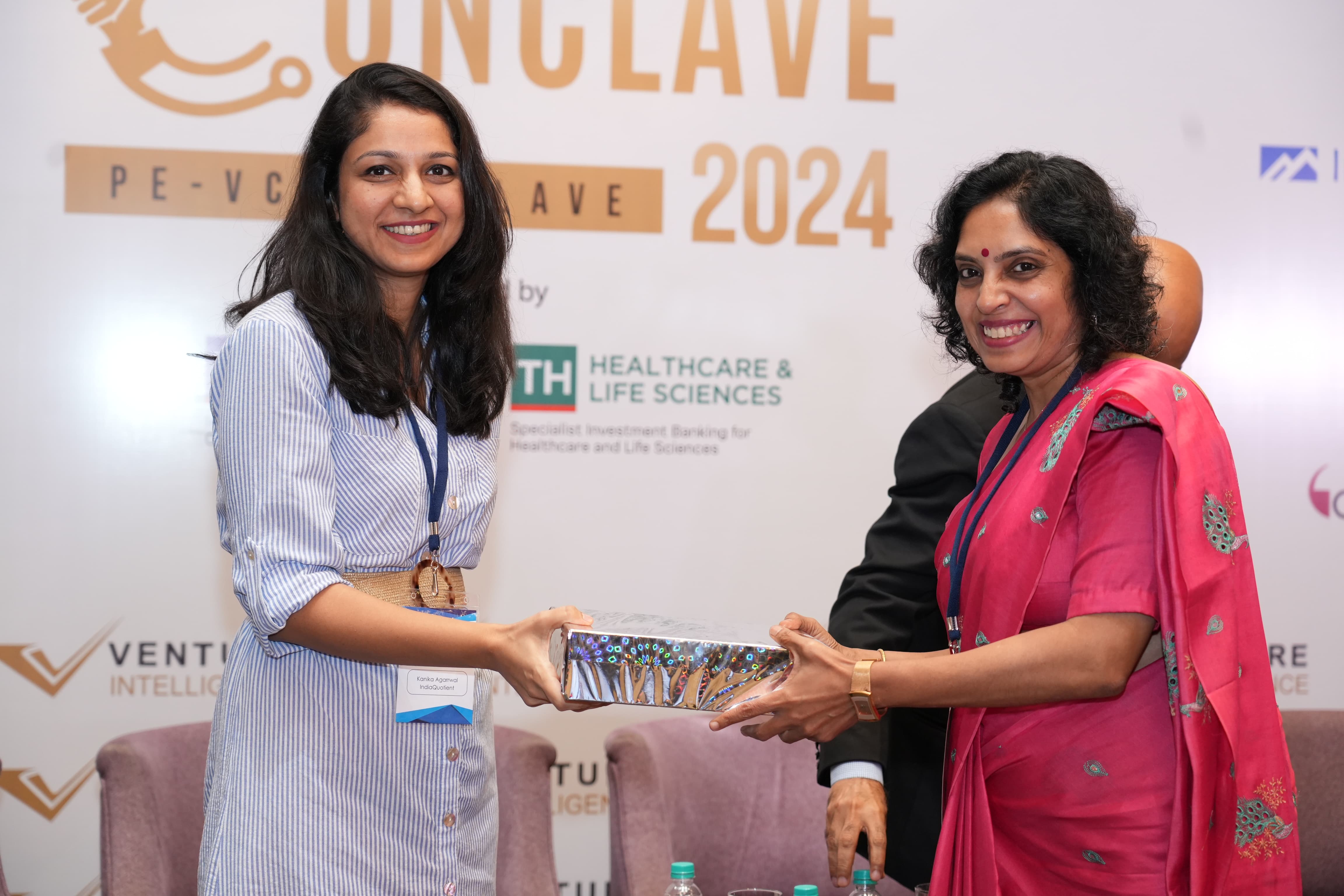 Receiving the executive search excellence award on stage